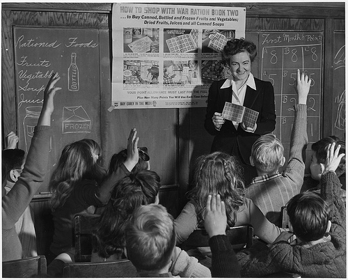 Black and white photo of a teacher in the classroom